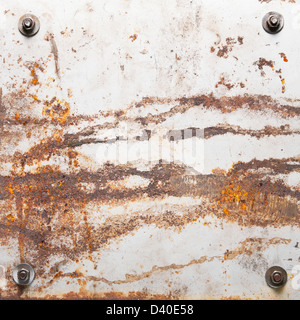 Rusty metal plate texture with bolts. Stock Photo