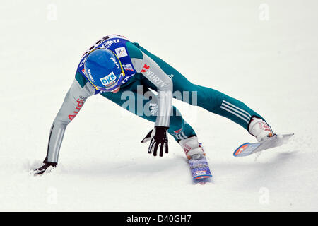 Val di Fiemme, Italy. 28th February 2013. Tino Edelmann of Germany falls during the Nordic Combined team competition jump at the Nordic Skiing World Championships. Photo: Daniel Karmann/dpa/Alamy Live News