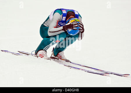 Val di Fiemme, Italy. 28th February 2013. Tino Edelmann of Germany reacts after he tumbled during the Nordic Combined team competition jump at the Nordic Skiing World Championships. Photo: Daniel Karmann/dpa/Alamy Live News
