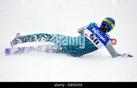 Val di Fiemme, Italy. 28th February 2013. Tino Edelmann of Germany falls during the Nordic Combined team competition jump at the Nordic Skiing World Championships. Photo: Daniel Karmann/dpa/Alamy Live News