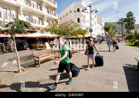 promenade boardwalk board walk tourists tourist tourism los cristianos tenerife beach canary islands isles canaries island holid Stock Photo