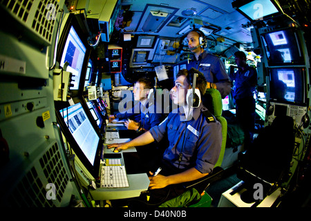 Sonar operators in the sound room of Nuclear Submarine HMS Talent Stock Photo