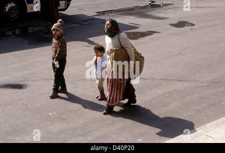 Woman with children on the streets of Paris France 1996. family mother and children migrant migration Europe European Stock Photo