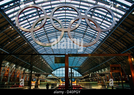 Giant Olympic rings St Pancras station in London, five aluminum rings in Olympic colors of blue, yellow, black, green and red Stock Photo