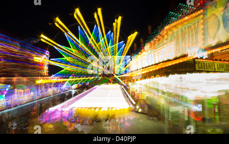 Carnival rides at night showing blurred motion at Italian Feast in Venice Florida Stock Photo