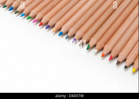 Line of coloured pencils on a white background Stock Photo