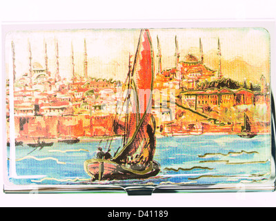 Painting of Istanbul, Bosphorus, Mosque and the ship on the metalic business card cover isolated on white background Stock Photo