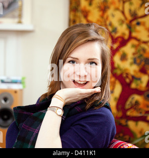 An attractive happy young caucasian brunette woman age aged 20 years old, front view, UK Stock Photo