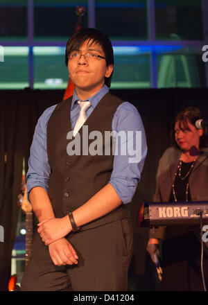 Feb. 27, 2013 - Garden City, New York, U.S. - LUIS TOLOSA, 18, a graduate of the Westbury STEM Magnet Academy (Science, Technology, Engineering, and Math) of the Cradle of Aviation, spoke at the 10th Annual Cradle of Aviation Museum Air & Space Gala, celebrating the 40th Anniversary of Apollo 17. Behind Tolosa is LINDA ARMYN, Chair of the Board of Trustees of the museum. Stock Photo