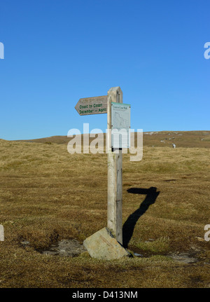 'Coast to Coast December - April', public bridleway fingerpost. Nateby Fell, Cumbria, England, United Kingdom, Europe. Stock Photo