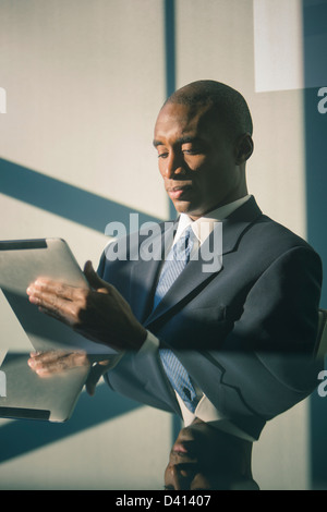 Black businessman using tablet computer Stock Photo