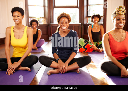 Women smiling in yoga class Stock Photo