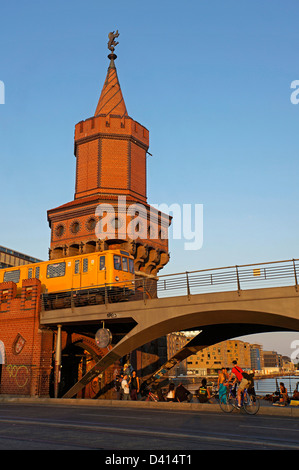 Oberbaum bridge over river Spree, Metro train, bicycles , Berlin  Stock Photo