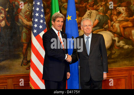 US Secretary of State John Kerry meets with Italian Prime Minister Mario Monti February 28, 2013 in Rome, Italy. Kerry is on an 11-day trip, his first as secretary of state stopping in London, Berlin, Paris, Rome, Ankara, Cairo, Riyadh, Abu Dhabi and Doha. Stock Photo