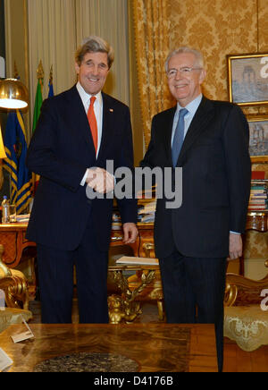 US Secretary of State John Kerry meets with Italian Prime Minister Mario Monti February 28, 2013 in Rome, Italy. Kerry is on an 11-day trip, his first as secretary of state stopping in London, Berlin, Paris, Rome, Ankara, Cairo, Riyadh, Abu Dhabi and Doha. Stock Photo