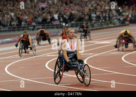 Hannah Cockroft of GB after winning gold in the womens 200m - T34 in the Olympic stadium at the London 2012 Paralympic games. Stock Photo