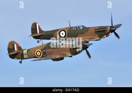 Spitfire 1A plane & Hurricane Mk. XIIA plane in RAF Battle of Britain 1940 camouflage displaying at Duxford Airshow. Stock Photo