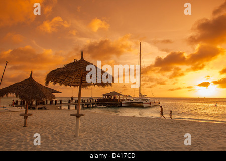 Aruba Palm Beach sunset West Indies Dutch Carribean Central America ABC Catamaran Stock Photo