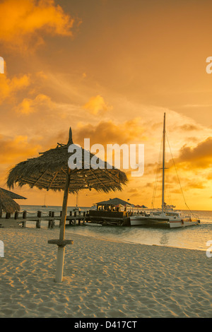 Aruba Palm Beach sunset West Indies Dutch Carribean Central America ABC Catamaran Stock Photo