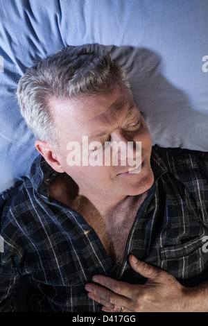 Mature  Man Happily Sleeping Stock Photo