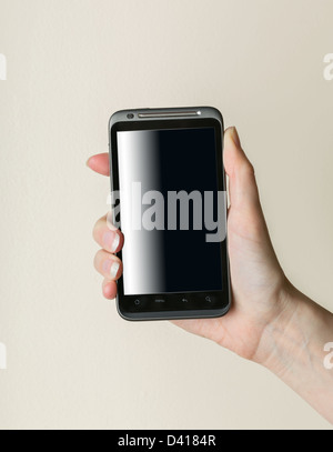 Female lady hand gripping black smartphone of android type Stock Photo