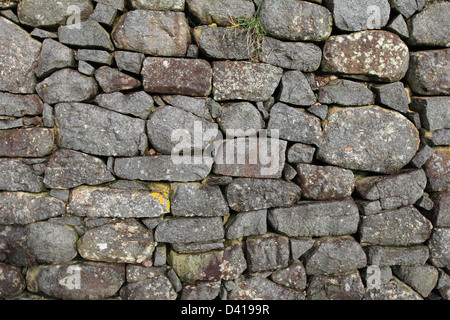 a wall made from stones stone wall built in the 1500s in Nova Scotia Canada Stock Photo