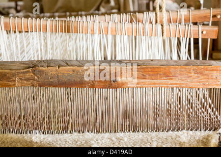 Old weaving loom made from timber making cloth in La Purisima mission California Stock Photo