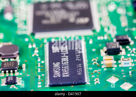 Closeup of electronic printed circuit board showing Surface Mount Technology (SMT), with shallow depth of field. Stock Photo