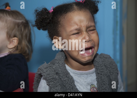 Upset child at a multicultural nursery school and early learning center in Brooklyn, NY. Stock Photo