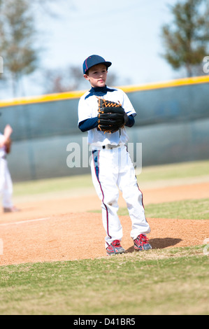 Little league baseball pitcher getting ready to throw the ball. Stock Photo