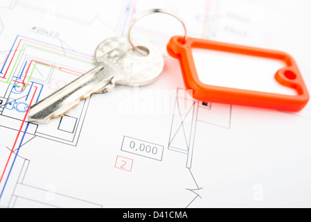 Concept of housing. Key on a blueprint . Stock Photo