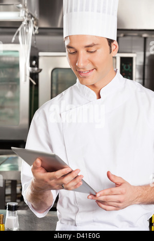 Chef Using Digital Tablet Stock Photo