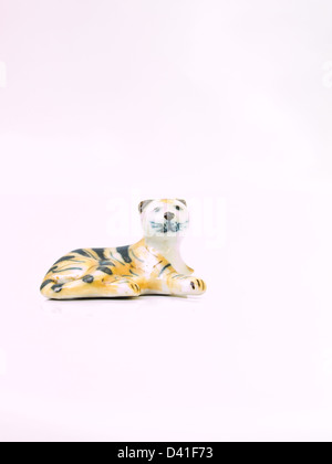 A miniature tiger ceramic doll isolated on white, handicraft from the North of Thailand Stock Photo