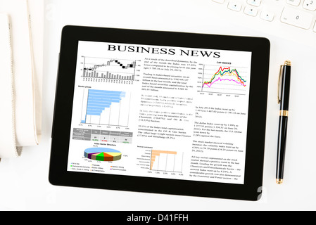digital tablet with business news on screen Stock Photo