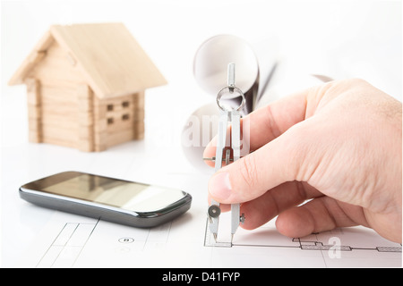 architect hand with tool and smartphone Stock Photo