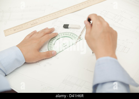 Hands male architect to make drawings using various line pencil and compass Stock Photo
