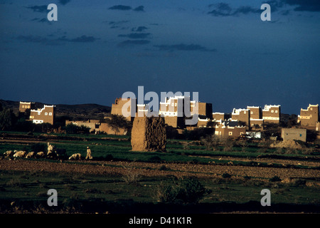 Typical village in Asir Province of Saudi Arabia. Men and sheep. Stock Photo