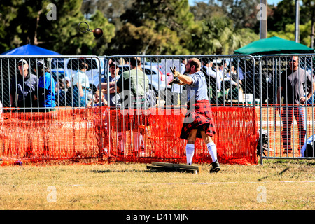 At the Sarasota Highland Games Florida, a competitor throws a shot put Stock Photo