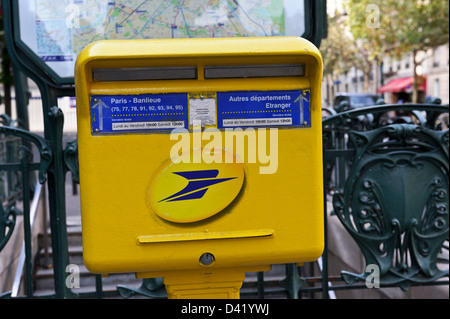 Yellow letterbox in Paris, France. Stock Photo