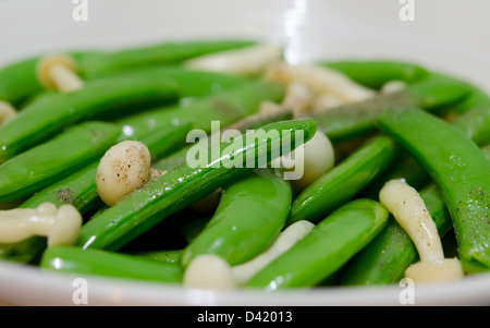 close up stir fried vegetables , pea and mushroom Stock Photo