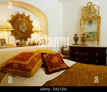 Antique Gold Sunburst In Alcove Above Bed With Tapestry