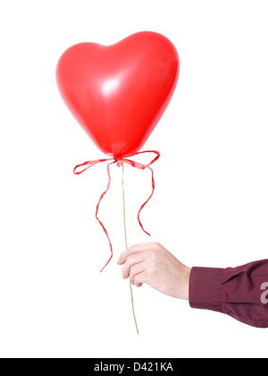 Male hand holding red heart-shaped balloon with cockade over white background Stock Photo