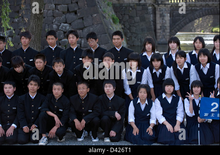 A group of Japanese high school girls in uniform on a field trip to the ...