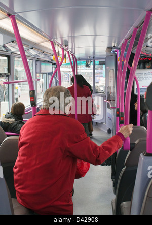 Interior of bus with female passengers preparing to leave, England UK Stock Photo