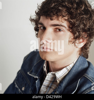 Portrait of a young man wearing denim jacket Stock Photo