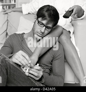 Man Doing His Girlfriend's Nails Stock Photo