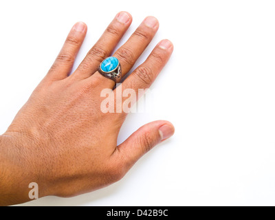 A guy hand with turquoise ring on his finger isolated on white background Stock Photo