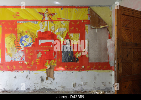Gross Dölln, Germany, dilapidated mural with Leninportraet and red star Stock Photo