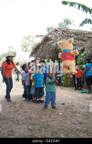 A Panamanian boy trying to break open a pinata at the Festival de la Naranja. Stock Photo