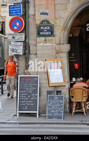 Menus on display outside French restaurant, Paris, France. Stock Photo
